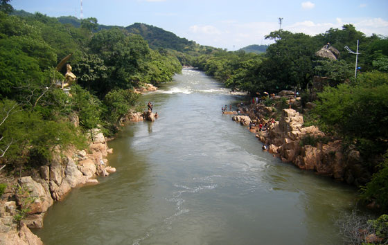 Hurtado River with the gold mermaid on the left riverbank, Valledupar