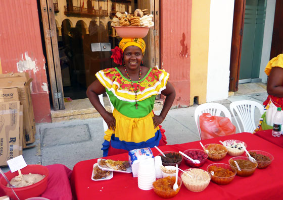 A traditional sweet seller in the Old City of Cartagena, Colombia