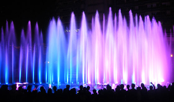 A water and light show on the banks of the Medellin River