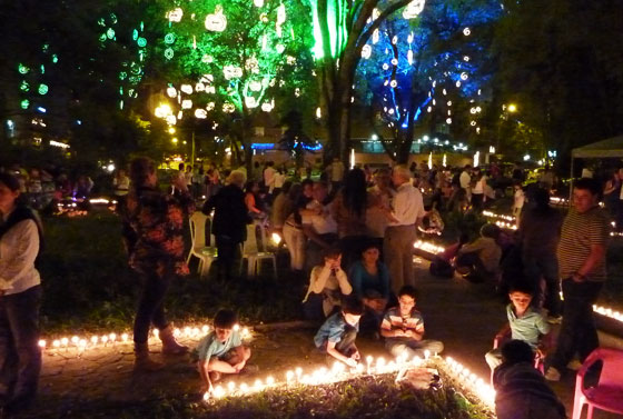 On Candle Night, parks and plazas are full of families lighting candles