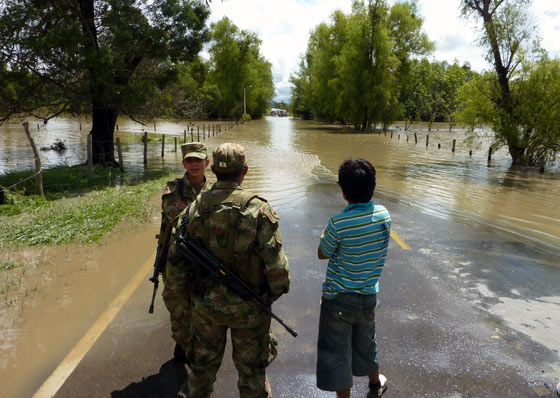 Flood waters block a road in Boyaca